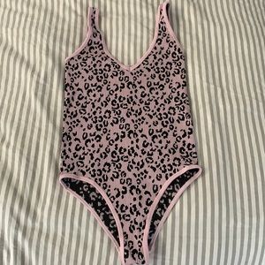Reversible pink/black leopard print bodysuit, never worn